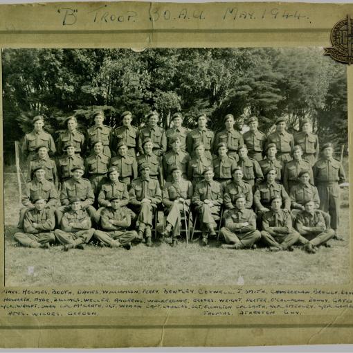 A black and white photograph of the 30 AU soldiers Troop photograph. Members of the Naval commando pose in uniform for a troop phtoograph